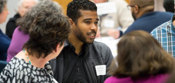 A group of people talking at an event