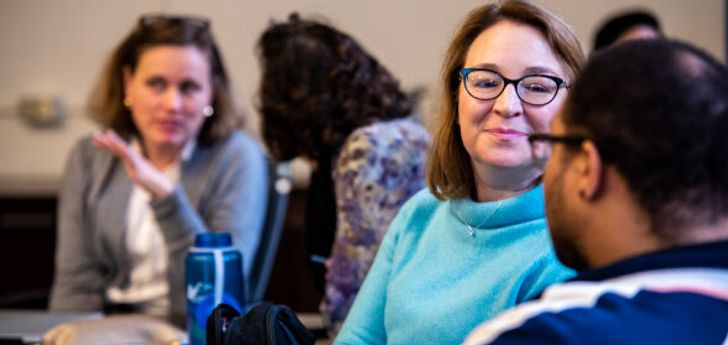 People having conversations while seated at an event